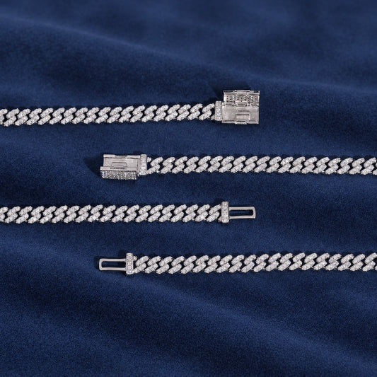 The four lengths of the 6mm Cuban link chain laid out side by side on navy suede