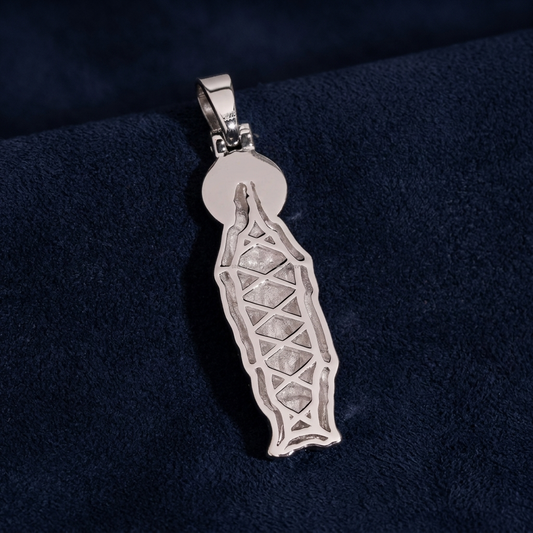 Virgin Mary Pendant back view showing engraved detail on dark navy suede