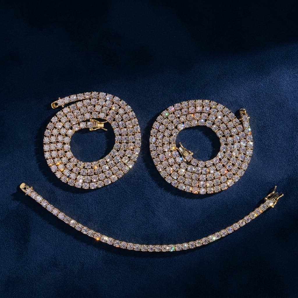 Gold tennis chains and matching bracelet coiled on navy suede, VVS moissanite