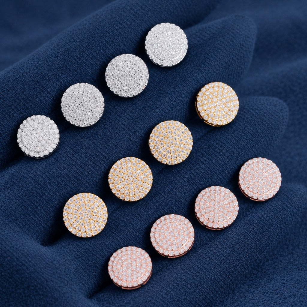 Ten Moon Cluster stud earrings laid out in silver, gold and rose gold on navy suede