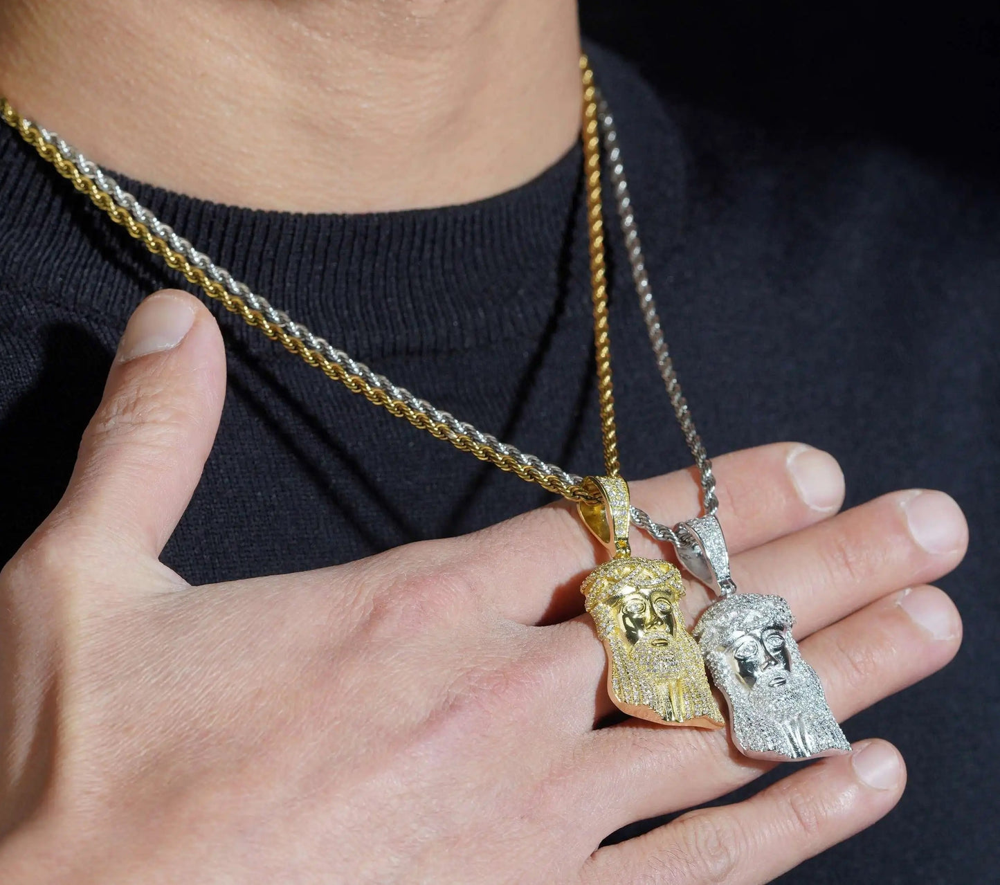 Man wearing gold and silver iced Jesus piece pendants on rope chains, lifestyle shot