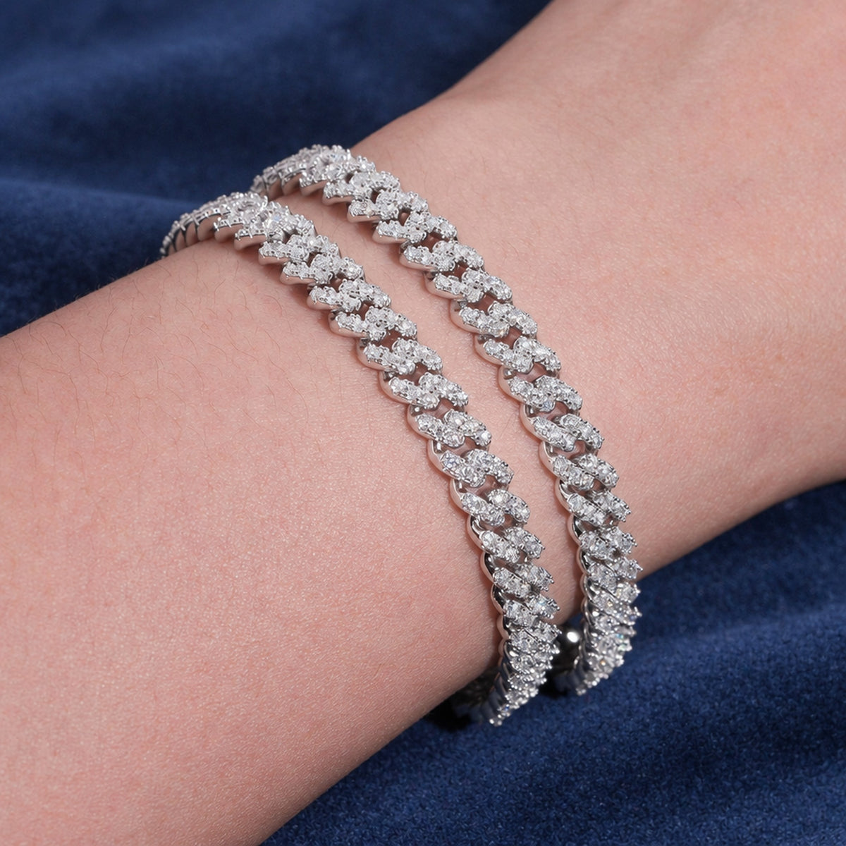 6mm Cuban link bracelets stacked on a wrist showing how they sit