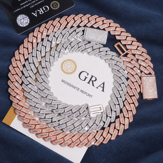 18mm two-tone baguette Cuban link chain coiled on navy suede with its GRA stone report