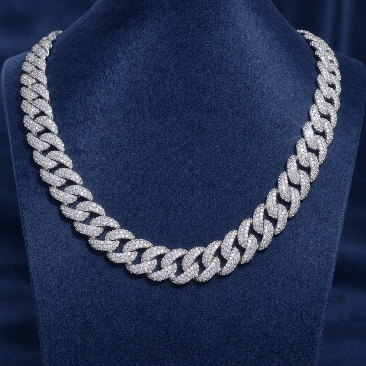 18mm Miami Cuban Chain shown on a navy display bust, iced VVS moissanite in 925 silver