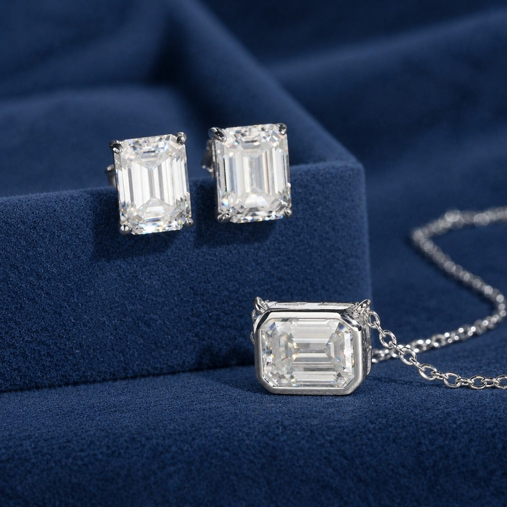 Emerald Cut moissanite studs and pendant close-up showing the step-cut facets