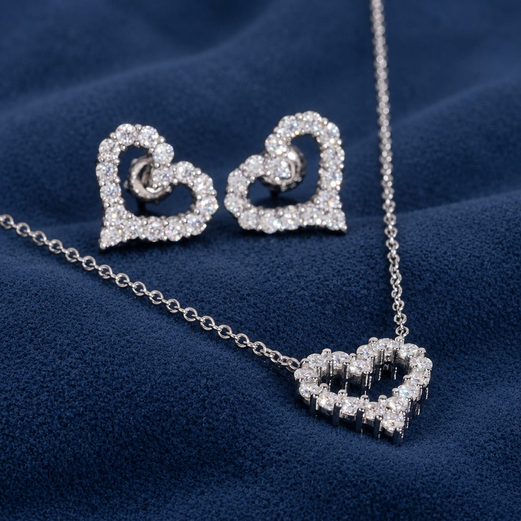 Iced Heart stud earrings and pendant close-up showing the pave stone outline