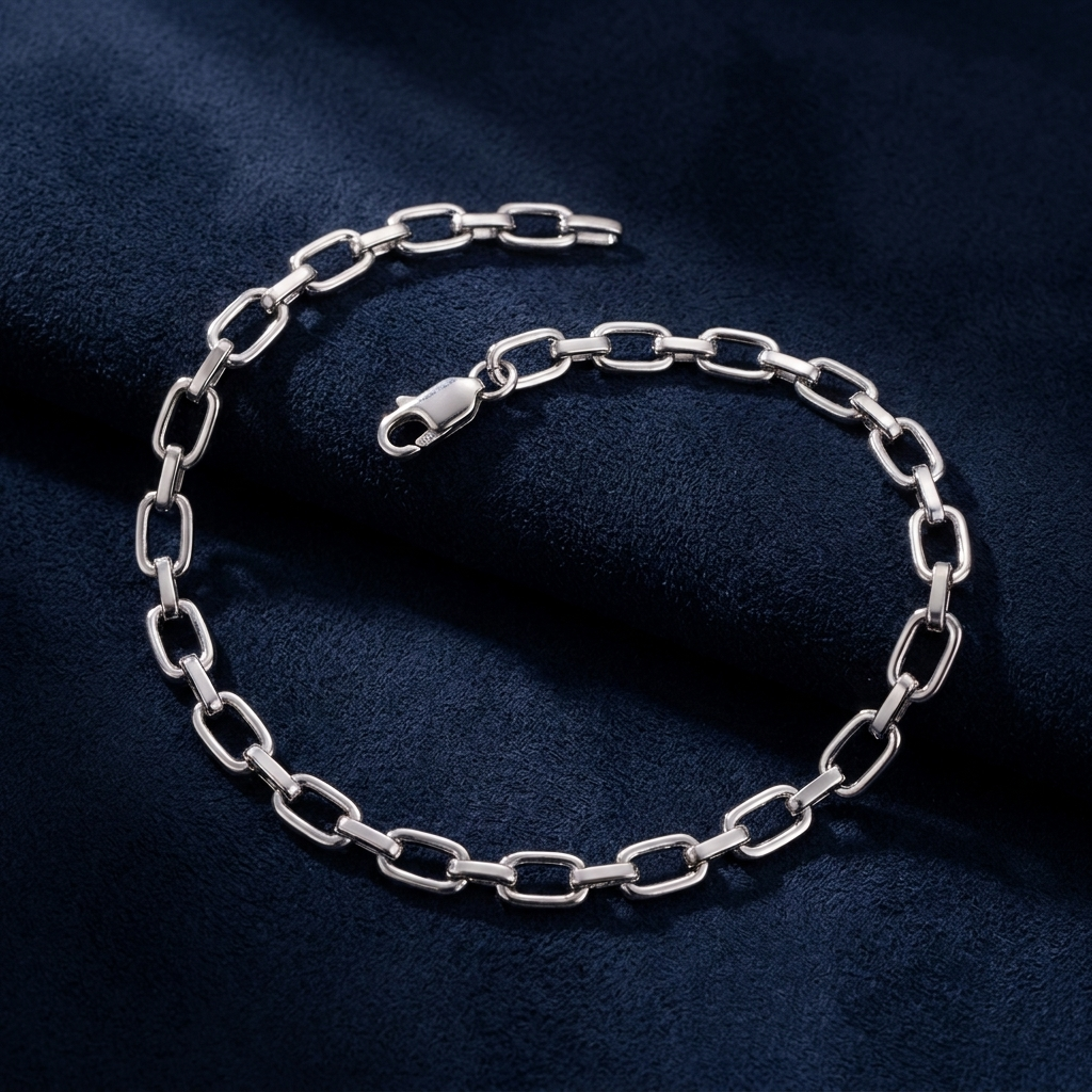 Infinity Link Bracelet back view showing plain polished 925 silver reverse side on dark navy suede