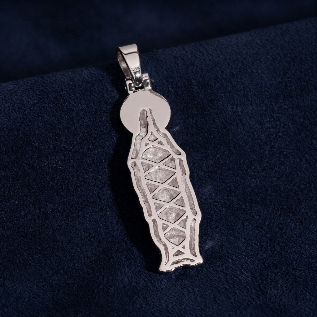 Virgin Mary Pendant back view showing engraved detail on dark navy suede