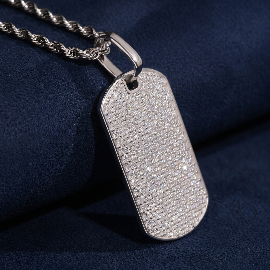 Iced Out Dog Tag Pendant three-quarter angle showing sparkle on dark navy suede
