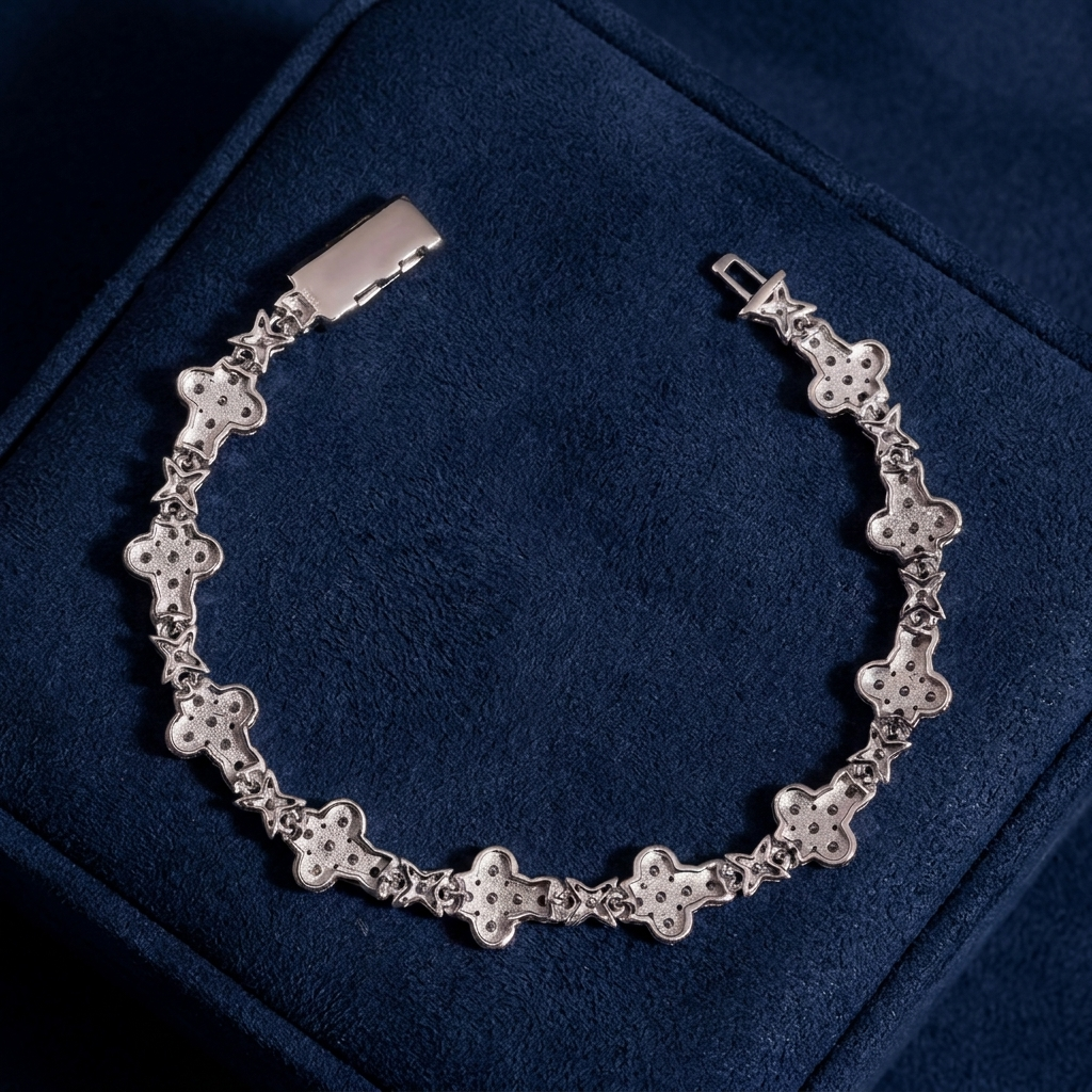 Back view of cross-link bracelet showing settings and box clasp on navy suede