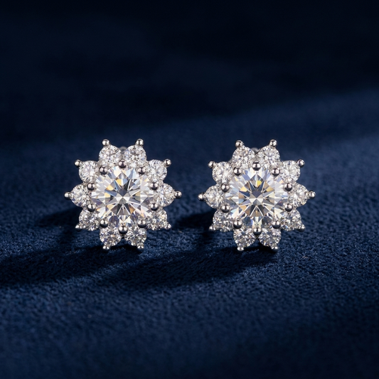 Pair of iced flower cluster stud earrings in 925 silver with VVS moissanite, on navy suede
