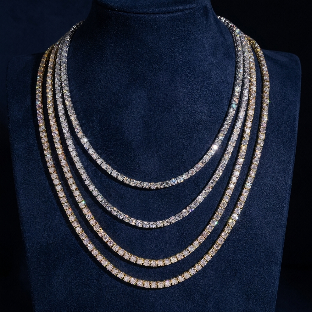 Four tennis chains in different widths draped on display bust, 925 silver and gold VVS moissanite, navy suede