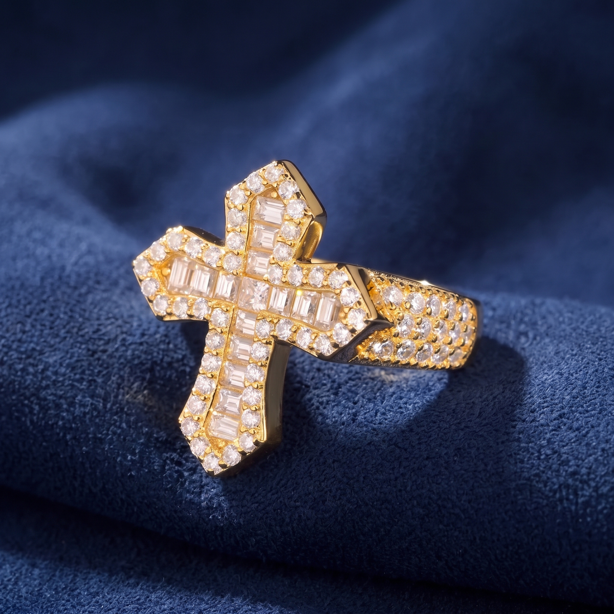 Angled view of gold baguette moissanite cross ring with pave shoulders