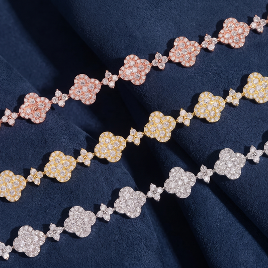 Close detail of pave flower clusters and four-stone connector links in moissanite
