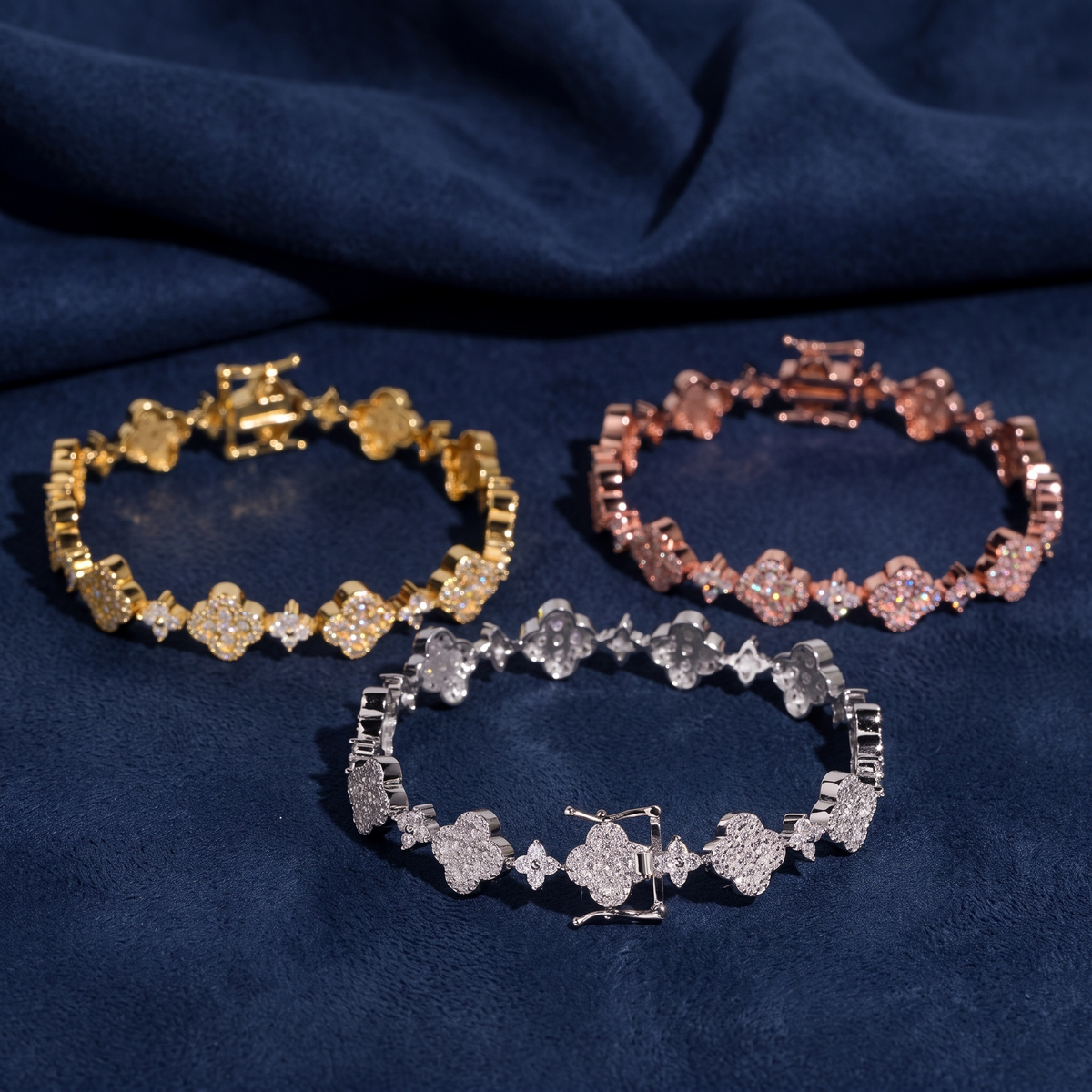 All three colorways of the flower cluster tennis bracelet showing box clasps
