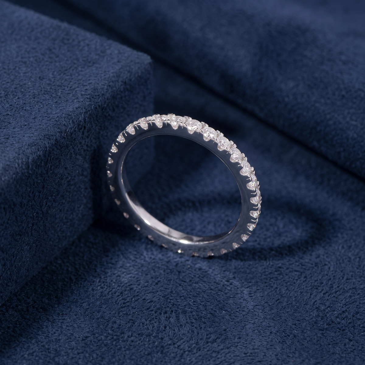 2mm silver eternity band ring in 925 sterling silver on navy suede