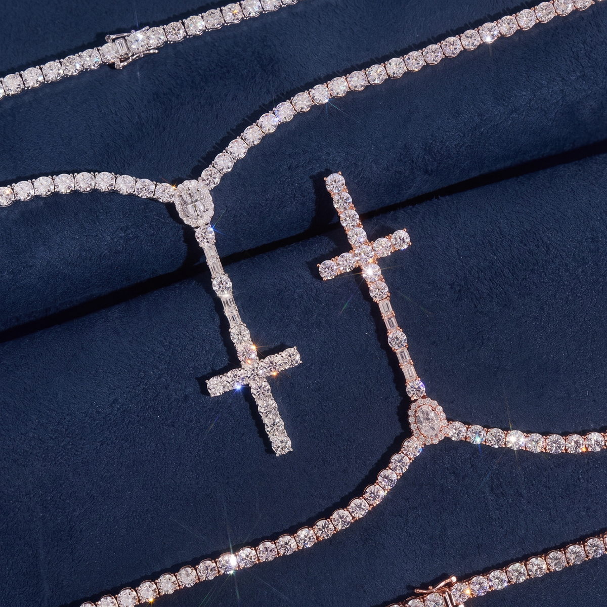Close detail of the iced cross pendant on the rosary tennis chain in silver and rose gold